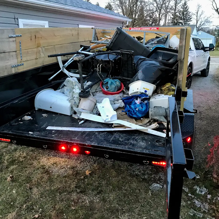 Roll-off dumpster delivered to a residential driveway in Neosho